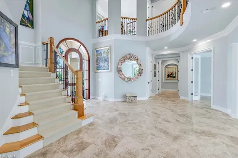 a view of a hallway with entryway front door