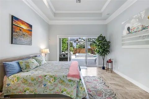 a bedroom with a large bed and a couch