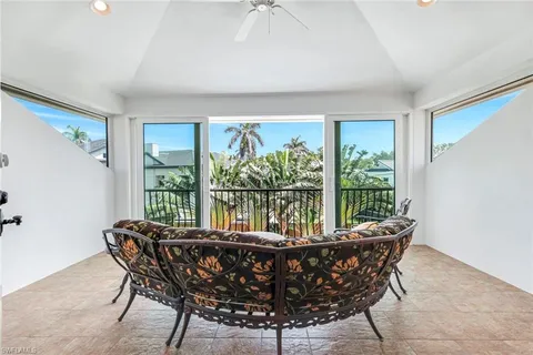 a dining room with furniture window and outside view