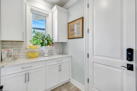 an aerial view of a house with a yard table and chairs