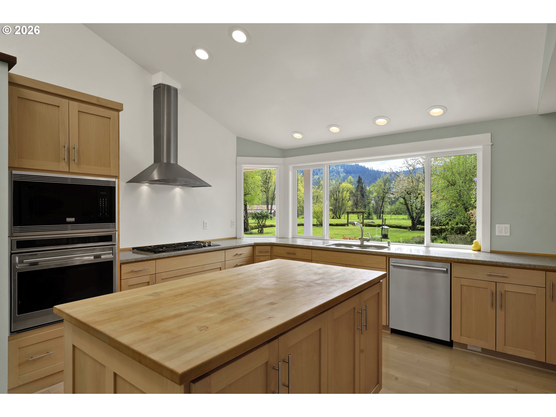 7924 Thurston Road Springfield, OR 97478 - Photo 18 of 45 a kitchen with a sink stove and cabinets