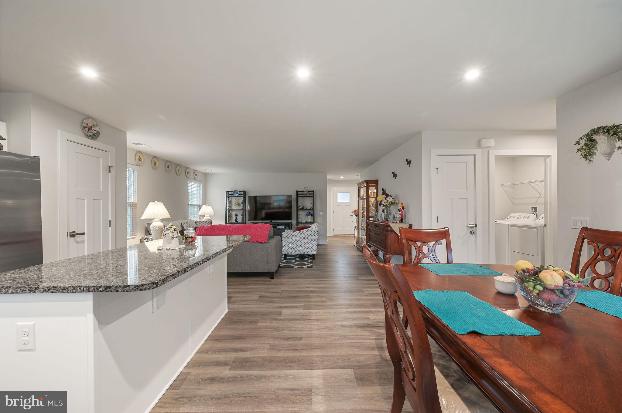 421 Laertes Drive Dover, DE 19901 - Photo 17 of 29 a living room with furniture and a wooden floor