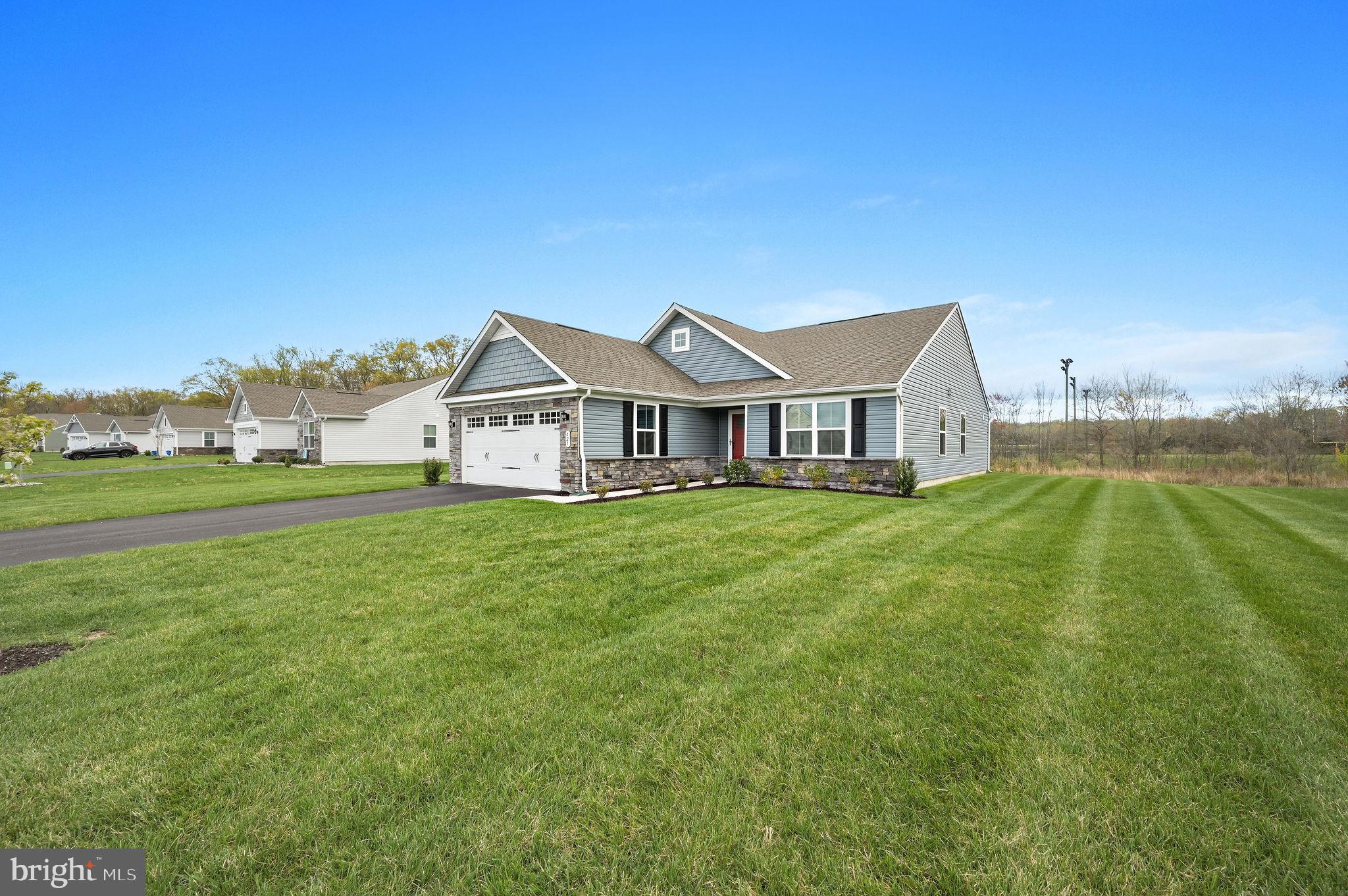 421 Laertes Drive Dover, DE 19901 - Photo 2 of 29 a front view of a house with a yard
