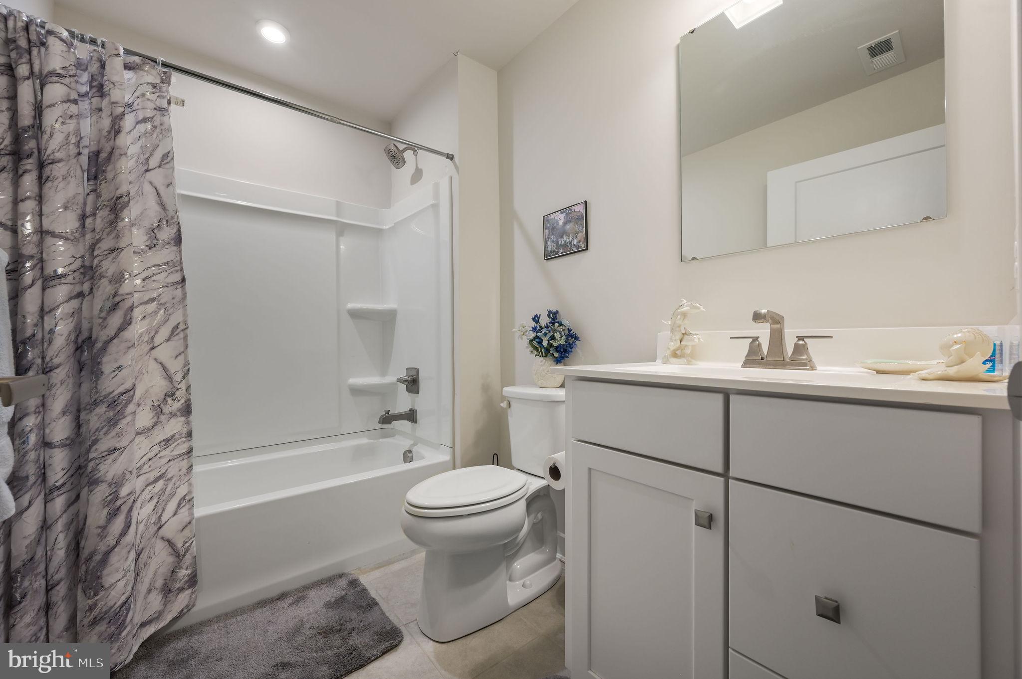 421 Laertes Drive Dover, DE 19901 - Photo 26 of 29 a bathroom with a sink toilet and shower