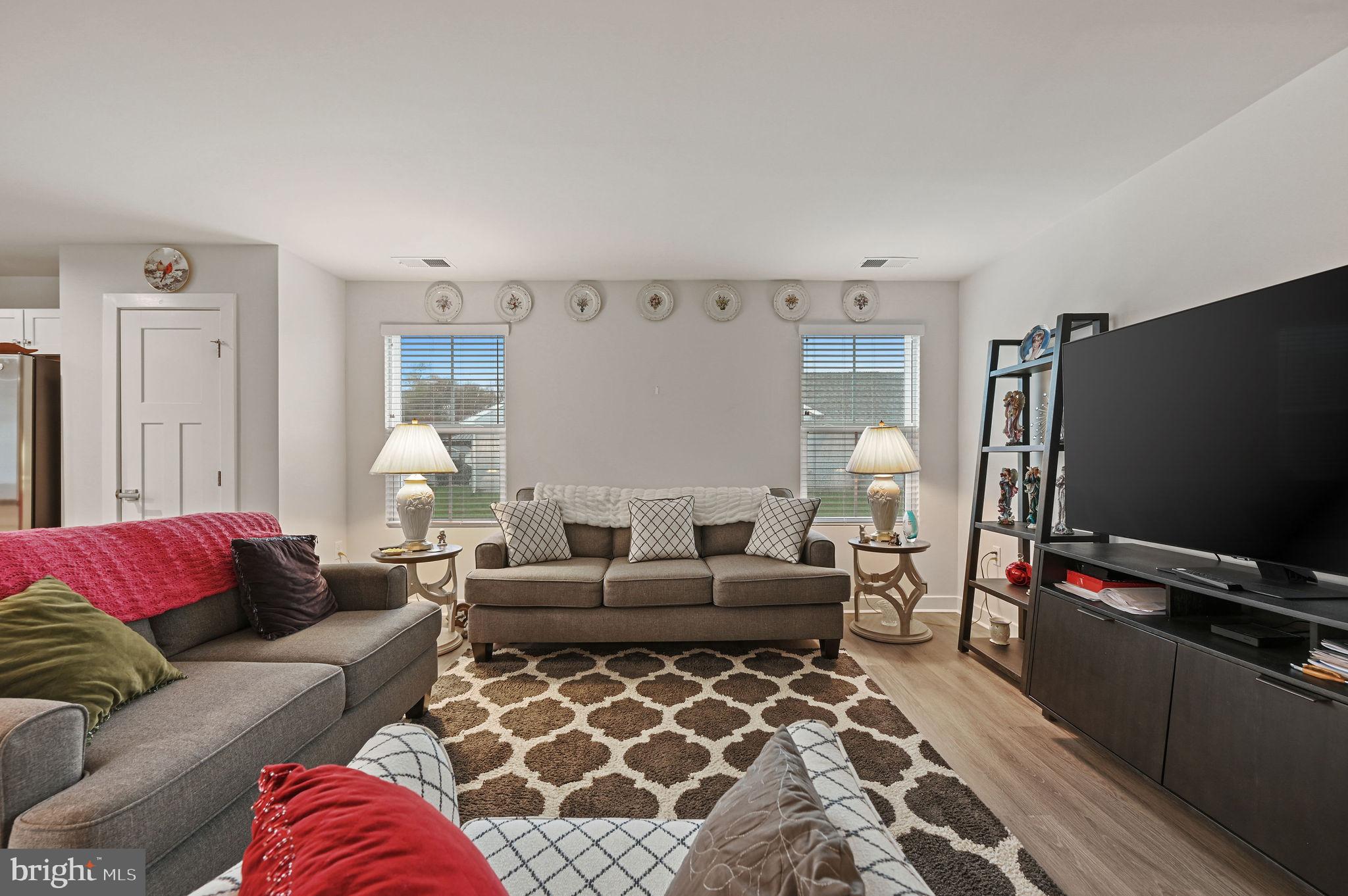 421 Laertes Drive Dover, DE 19901 - Photo 8 of 29 a living room with furniture and a flat screen tv