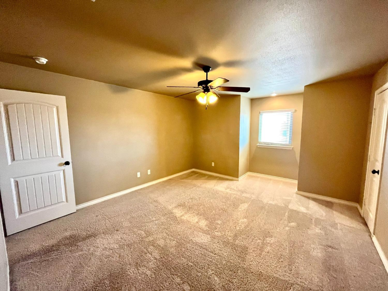 4419 106th Street, Unit B Lubbock, TX 79424 - Photo 13 of 20 en view of an empty room with a window