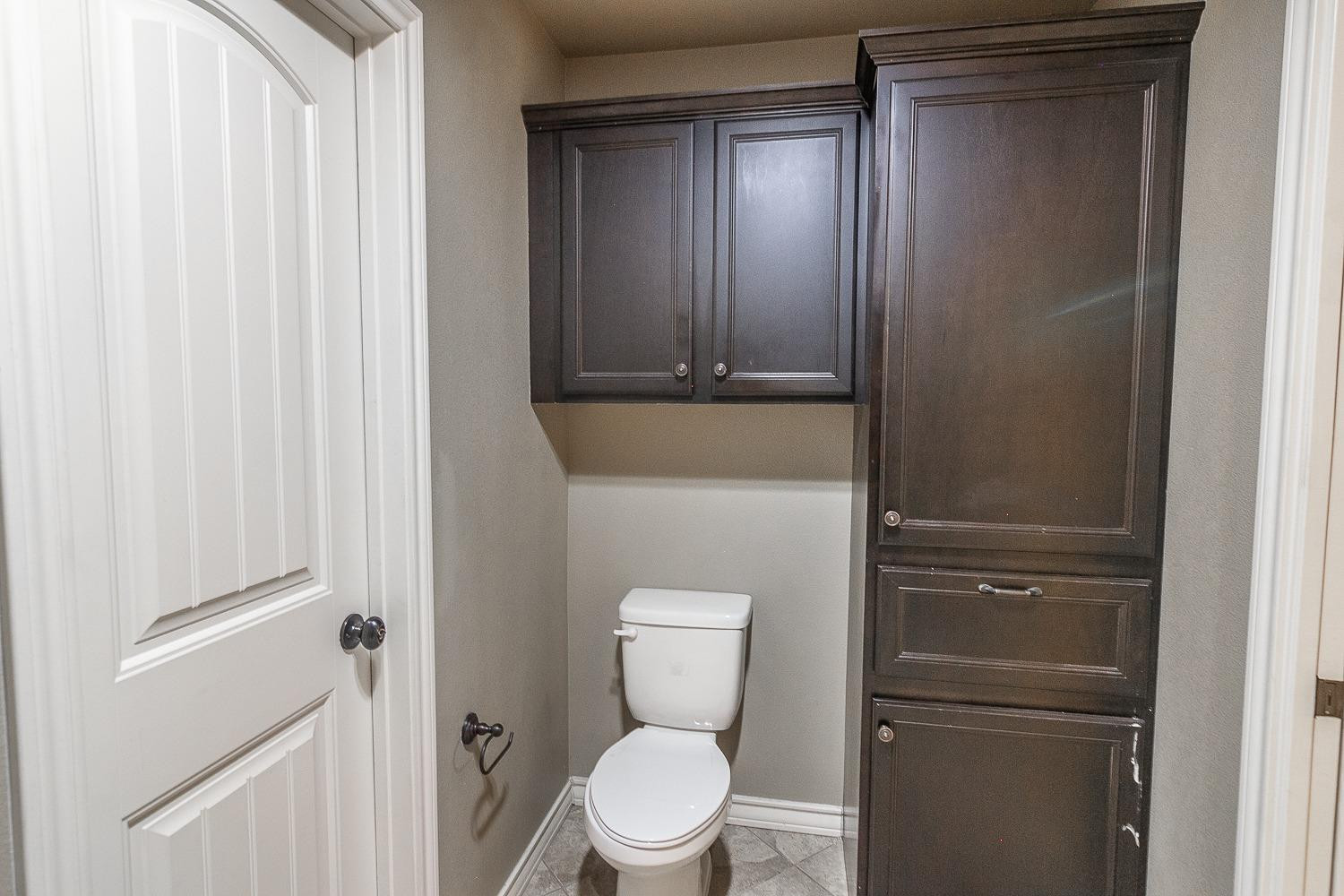 4419 106th Street, Unit B Lubbock, TX 79424 - Photo 20 of 20 a bathroom with a toilet