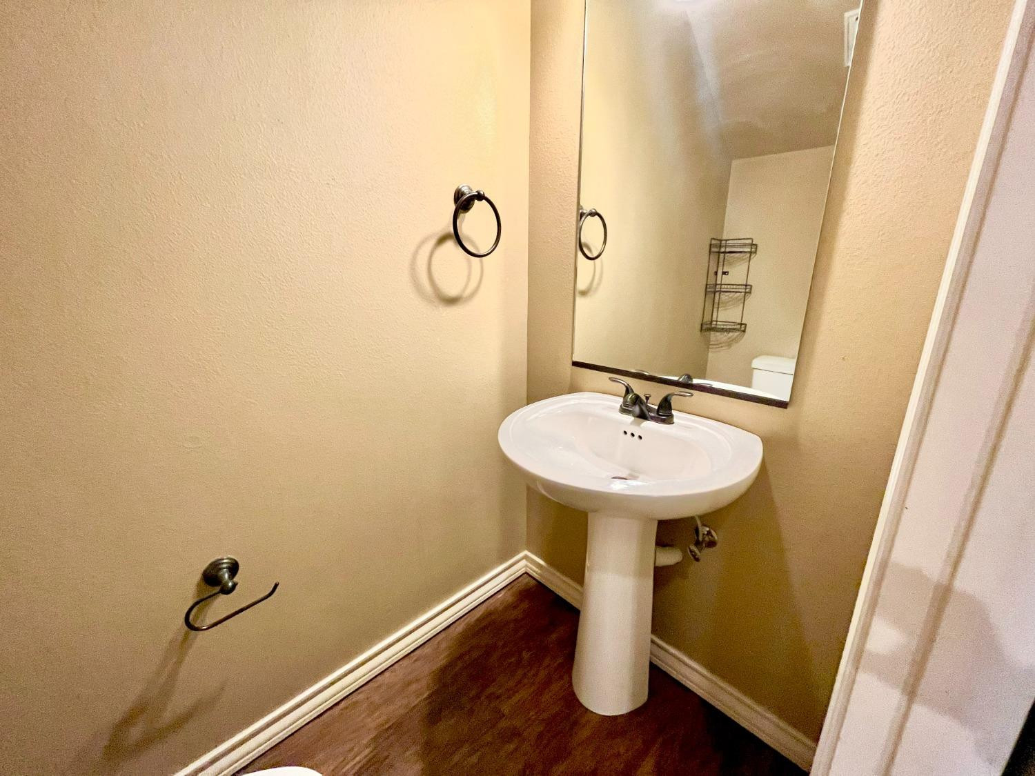 4419 106th Street, Unit B Lubbock, TX 79424 - Photo 10 of 20 a bathroom with a sink and mirror