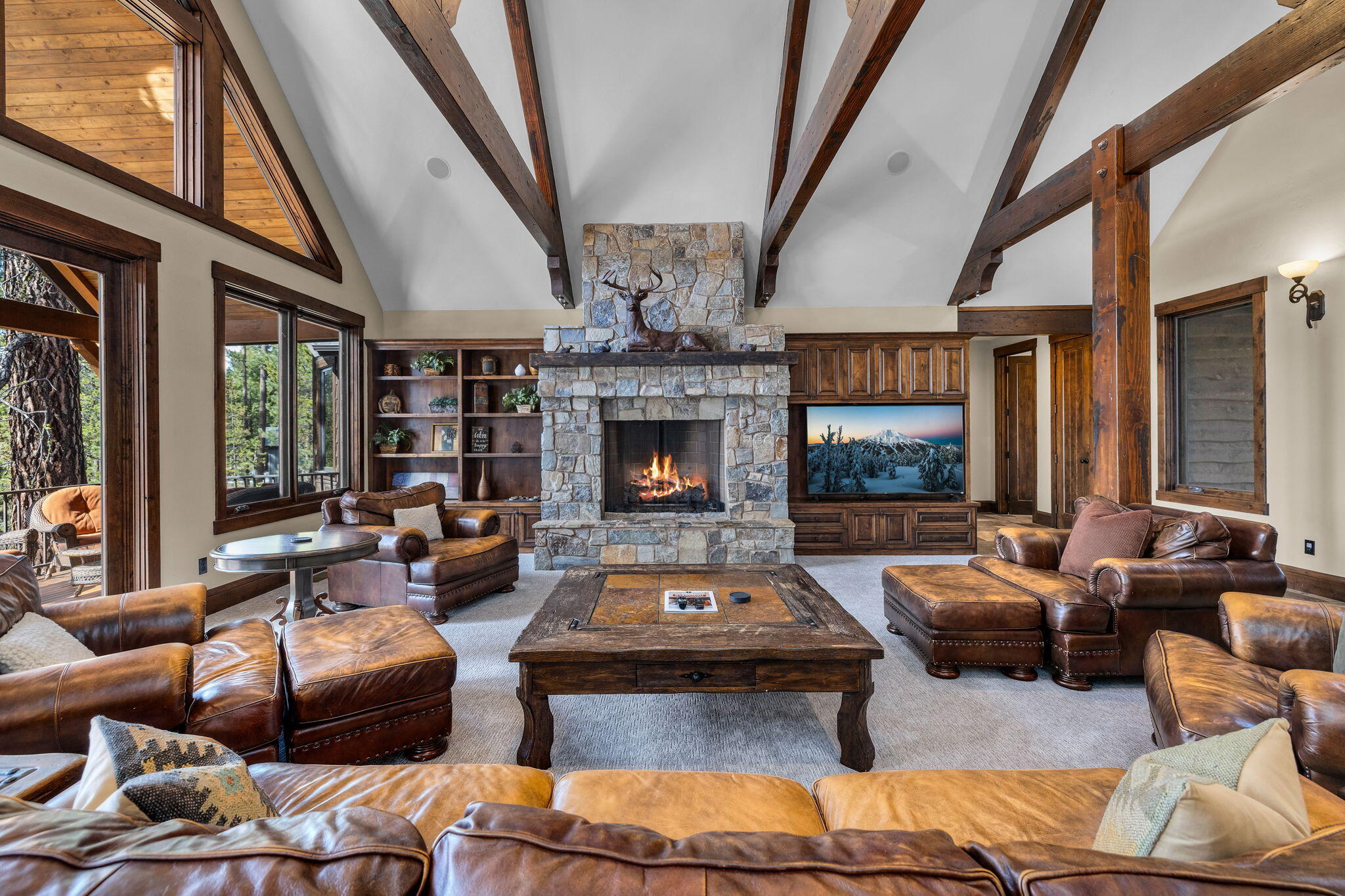 56373 Trailmere Circle Bend, OR 97707 - Photo 11 of 102 a living room with furniture and a fireplace