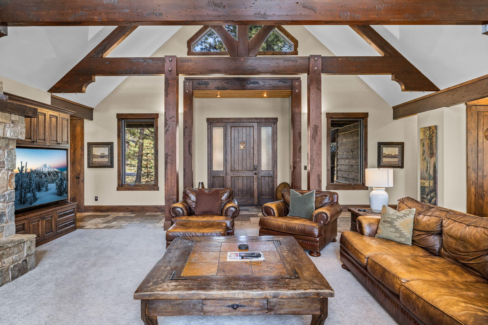 56373 Trailmere Circle Bend, OR 97707 - Photo 12 of 102 a living room with furniture and a fireplace