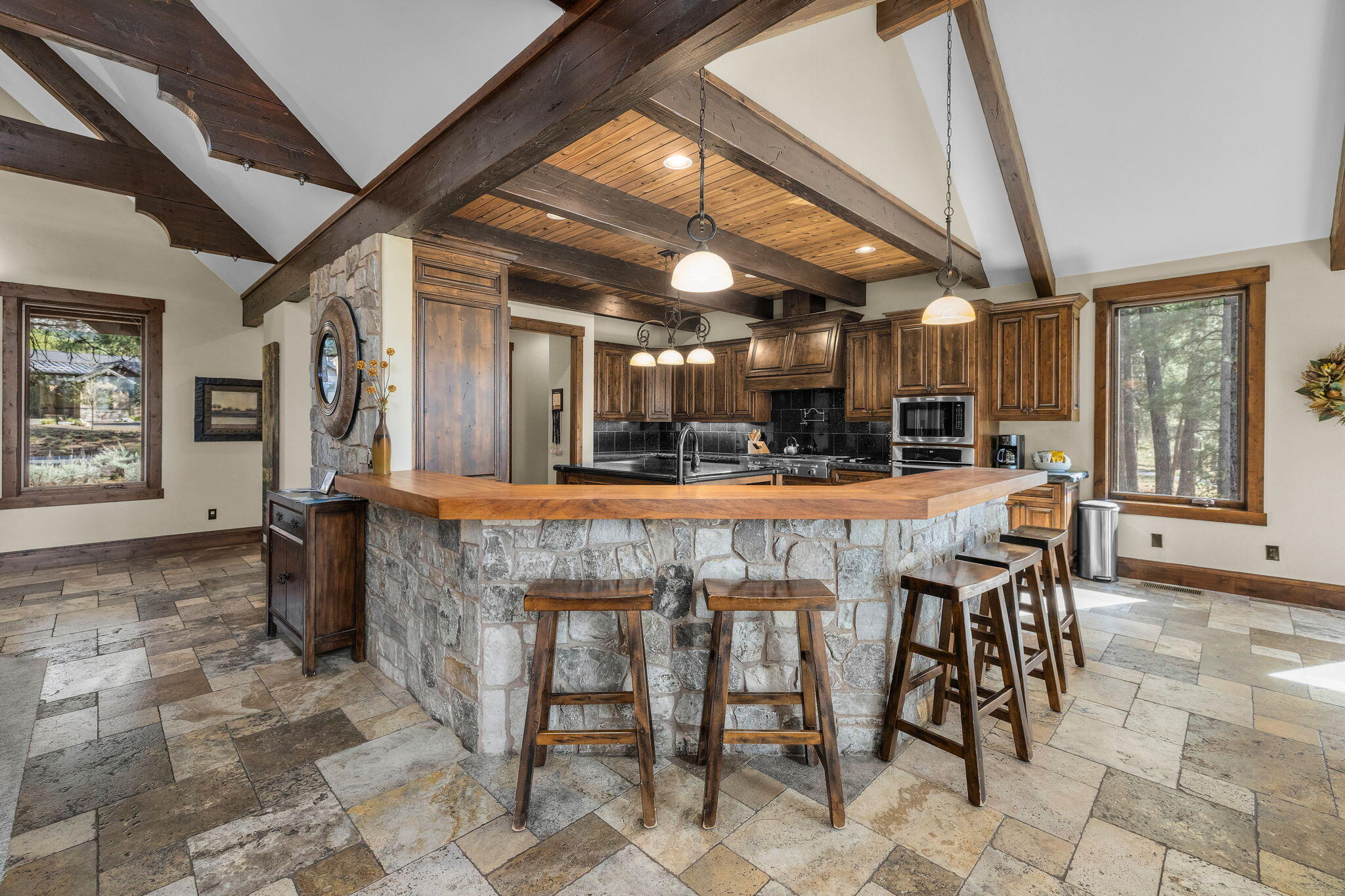 56373 Trailmere Circle Bend, OR 97707 - Photo 15 of 102 a view of a dining room with furniture window and outside view