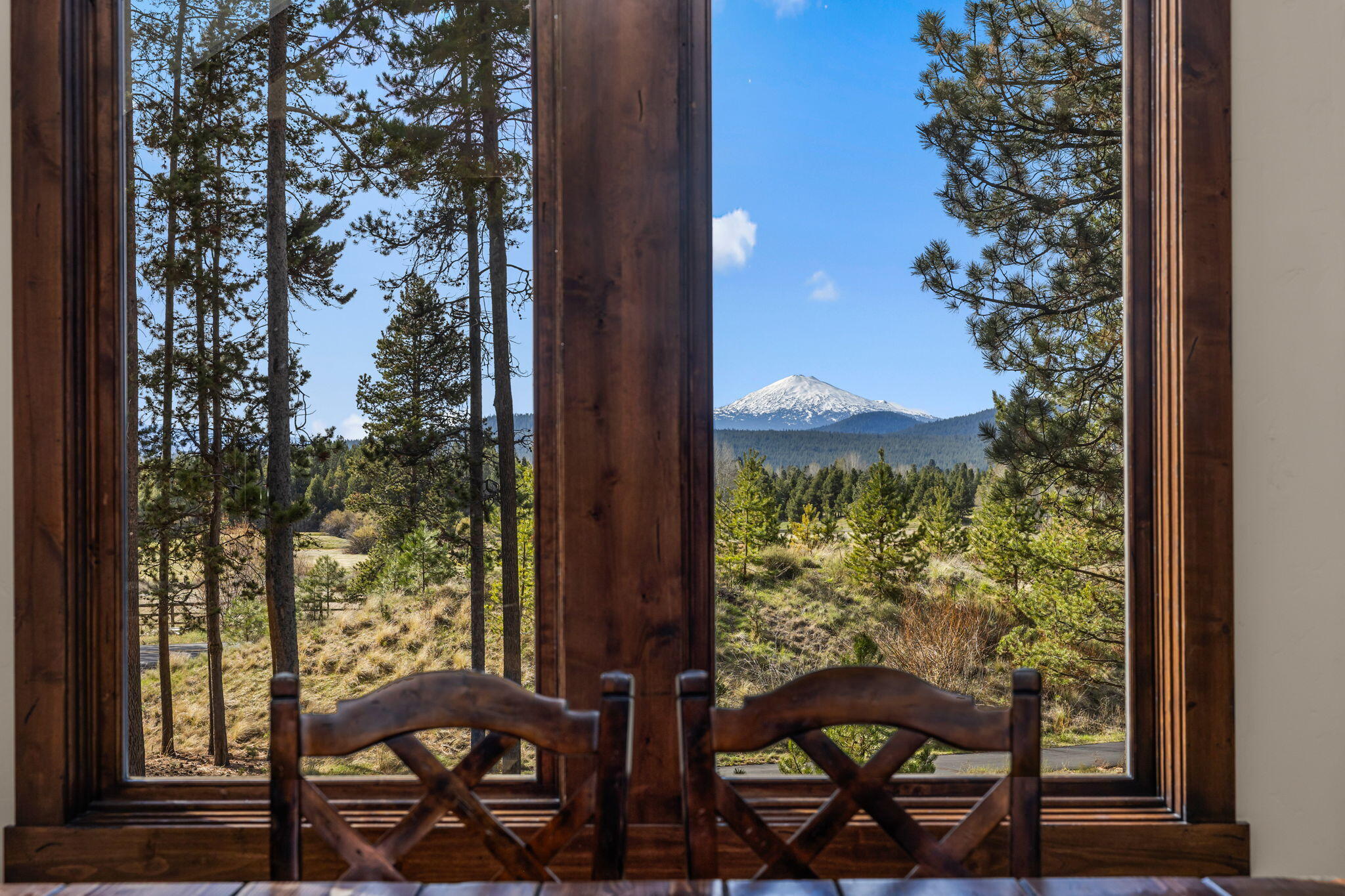 56373 Trailmere Circle Bend, OR 97707 - Photo 19 of 102 a view of a porch with a table and chairs in balcony