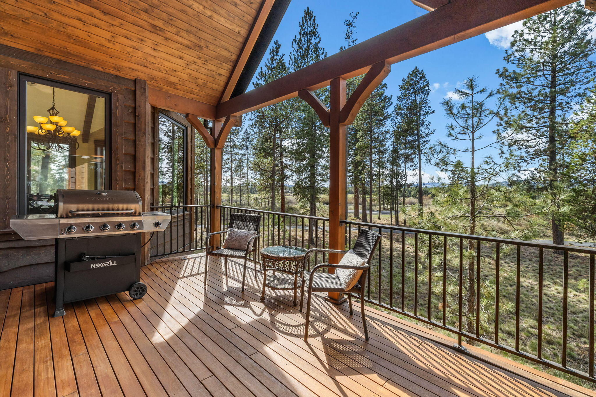 56373 Trailmere Circle Bend, OR 97707 - Photo 25 of 102 a view of a chairs and table on the wooden floor