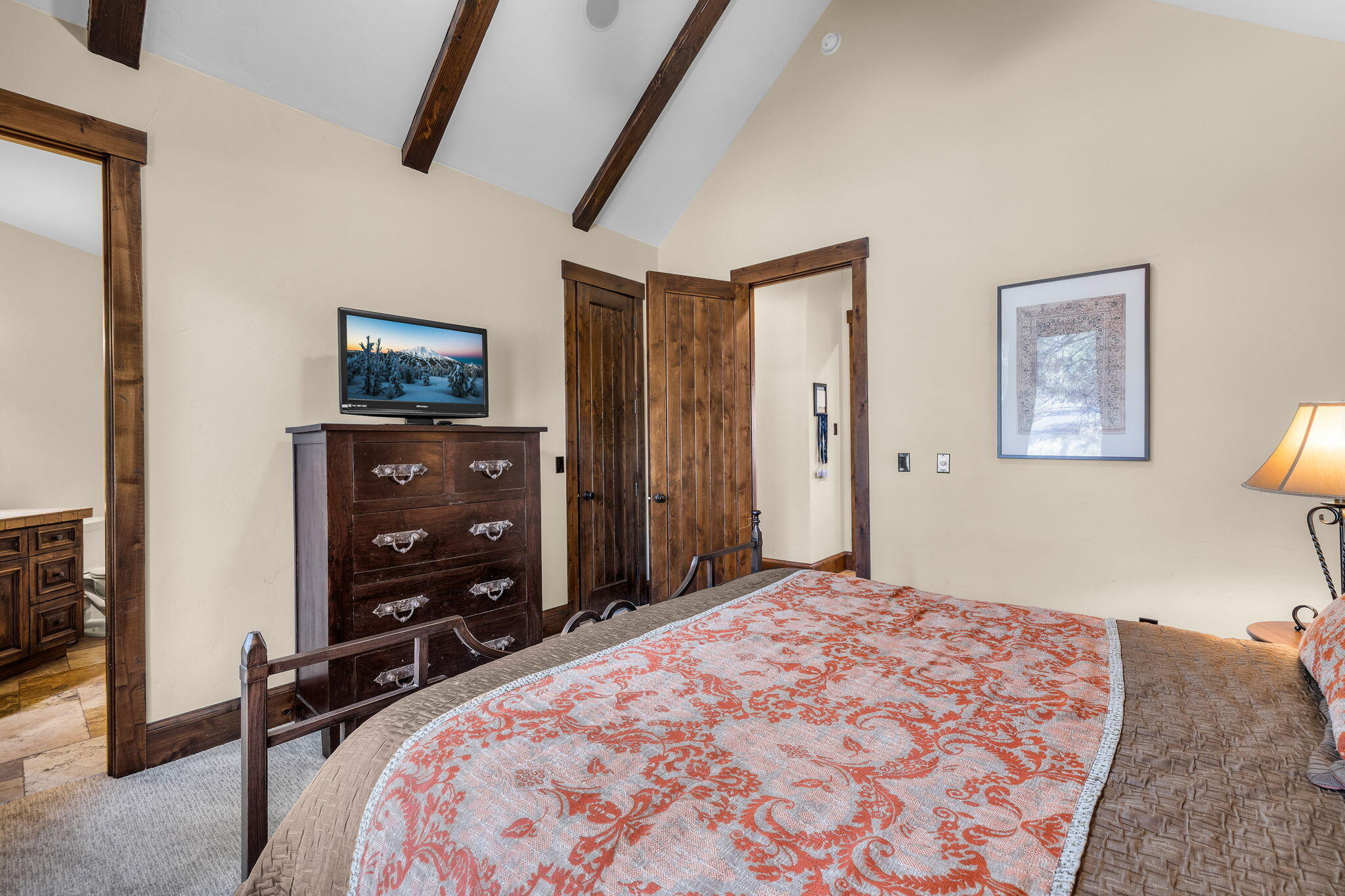56373 Trailmere Circle Bend, OR 97707 - Photo 31 of 102 a bedroom with a bed and a flat screen tv