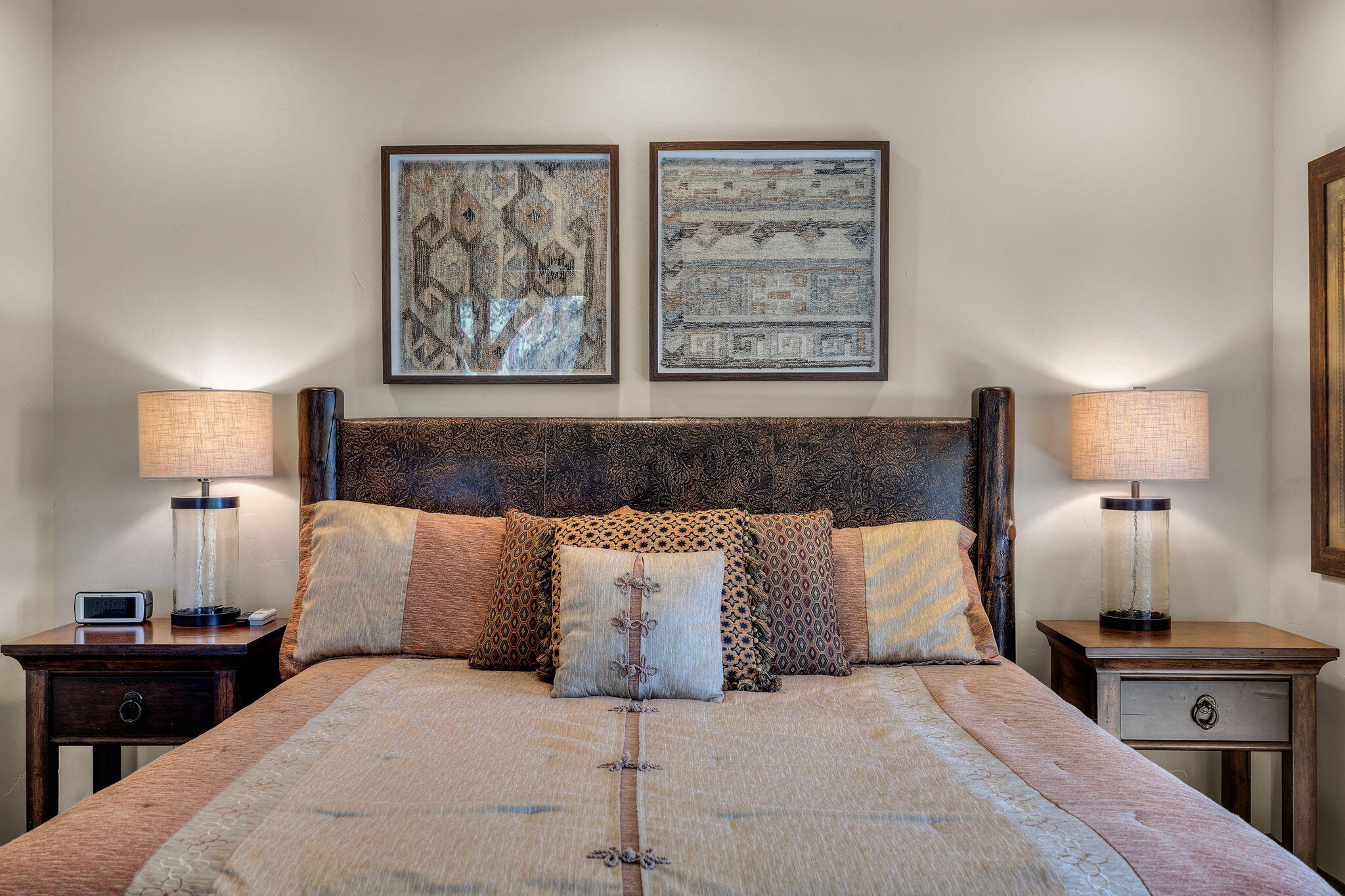 56373 Trailmere Circle Bend, OR 97707 - Photo 34 of 102 a bedroom with a large bed and a lamp