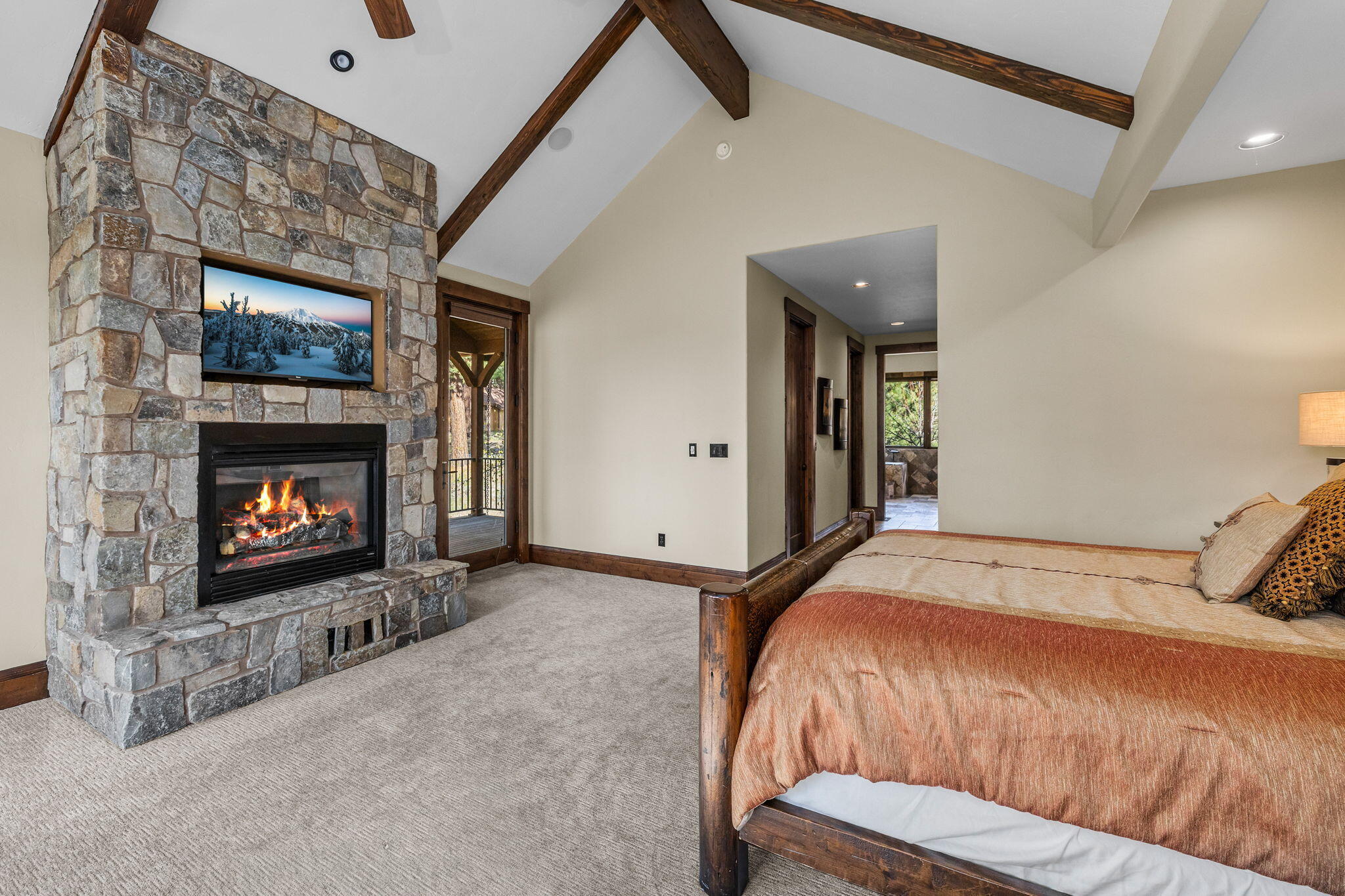 56373 Trailmere Circle Bend, OR 97707 - Photo 36 of 102 a bedroom with a bed and a fireplace