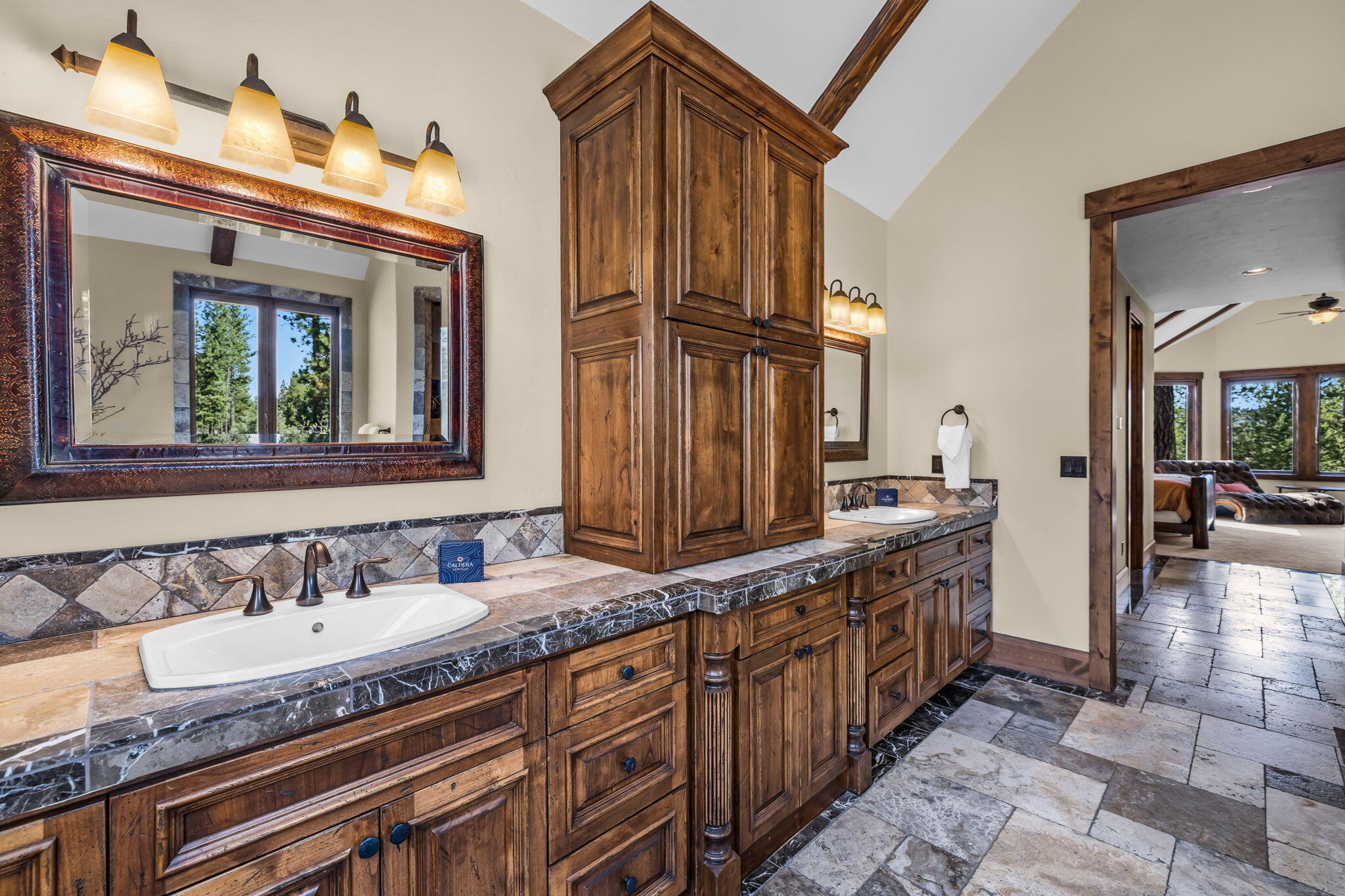 56373 Trailmere Circle Bend, OR 97707 - Photo 41 of 102 a bathroom with sinks granite countertop double vanity and a mirror