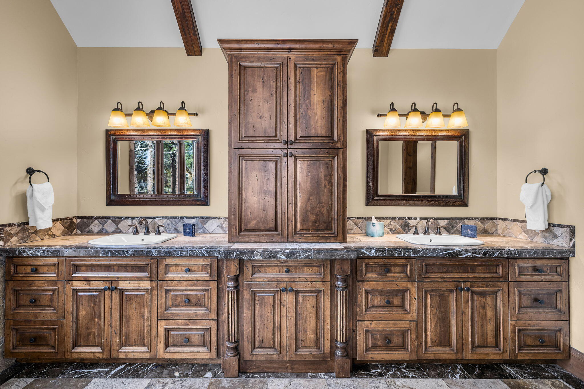 56373 Trailmere Circle Bend, OR 97707 - Photo 42 of 102 a bathroom with sinks granite vanity and a mirror
