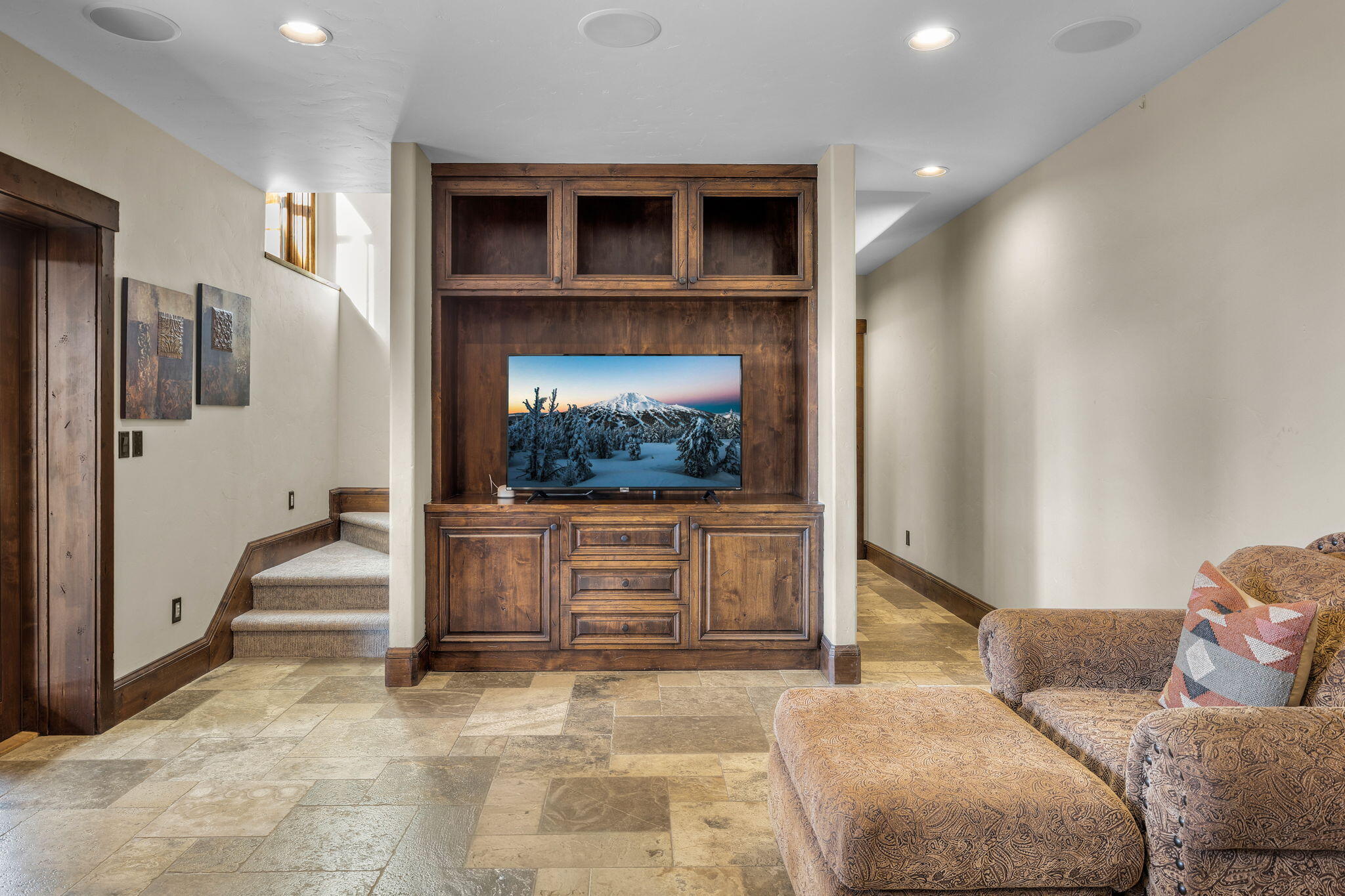 56373 Trailmere Circle Bend, OR 97707 - Photo 50 of 102 a living room with furniture and a fireplace