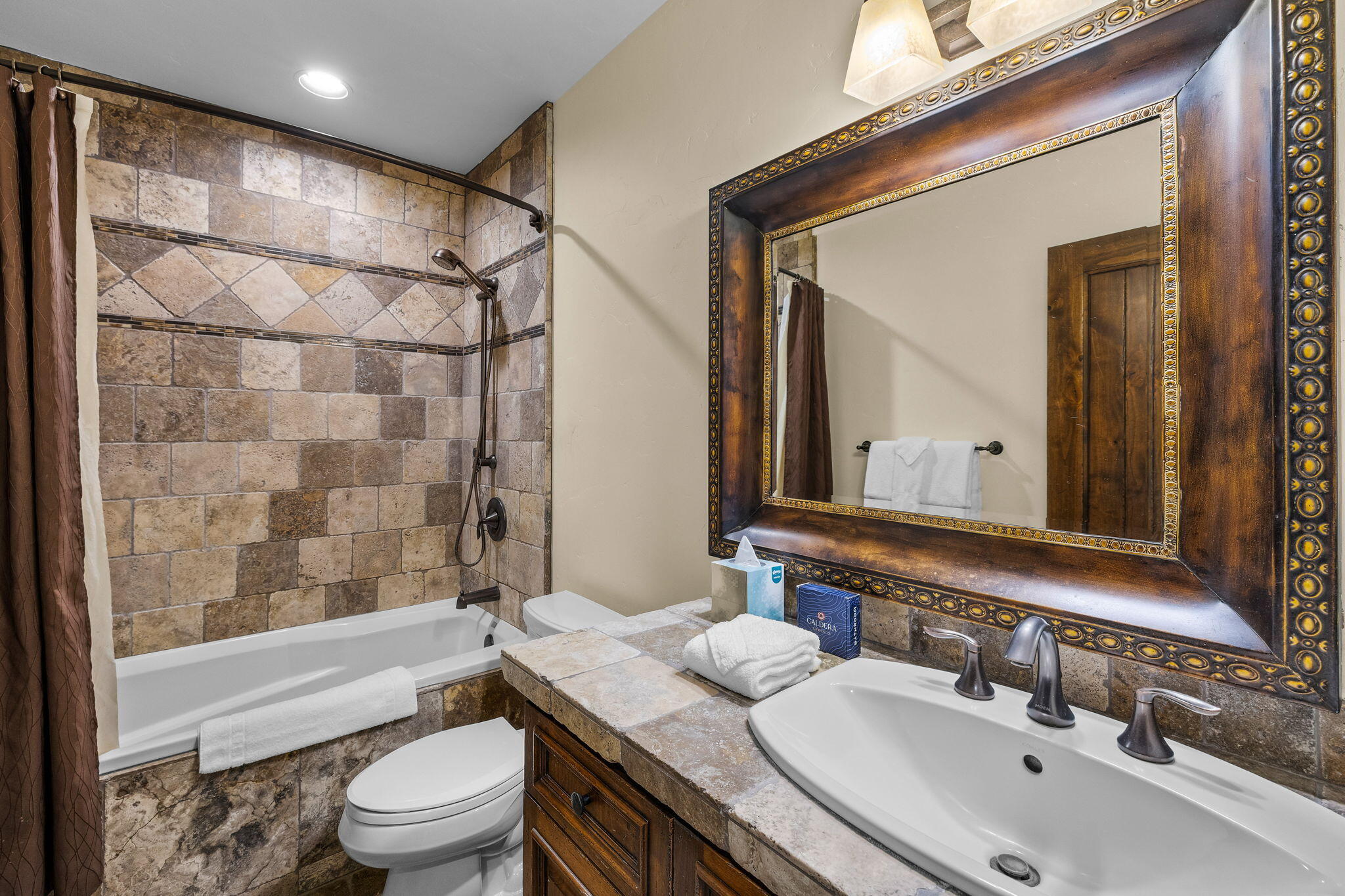 56373 Trailmere Circle Bend, OR 97707 - Photo 55 of 102 a bathroom with a granite countertop sink toilet mirror and shower