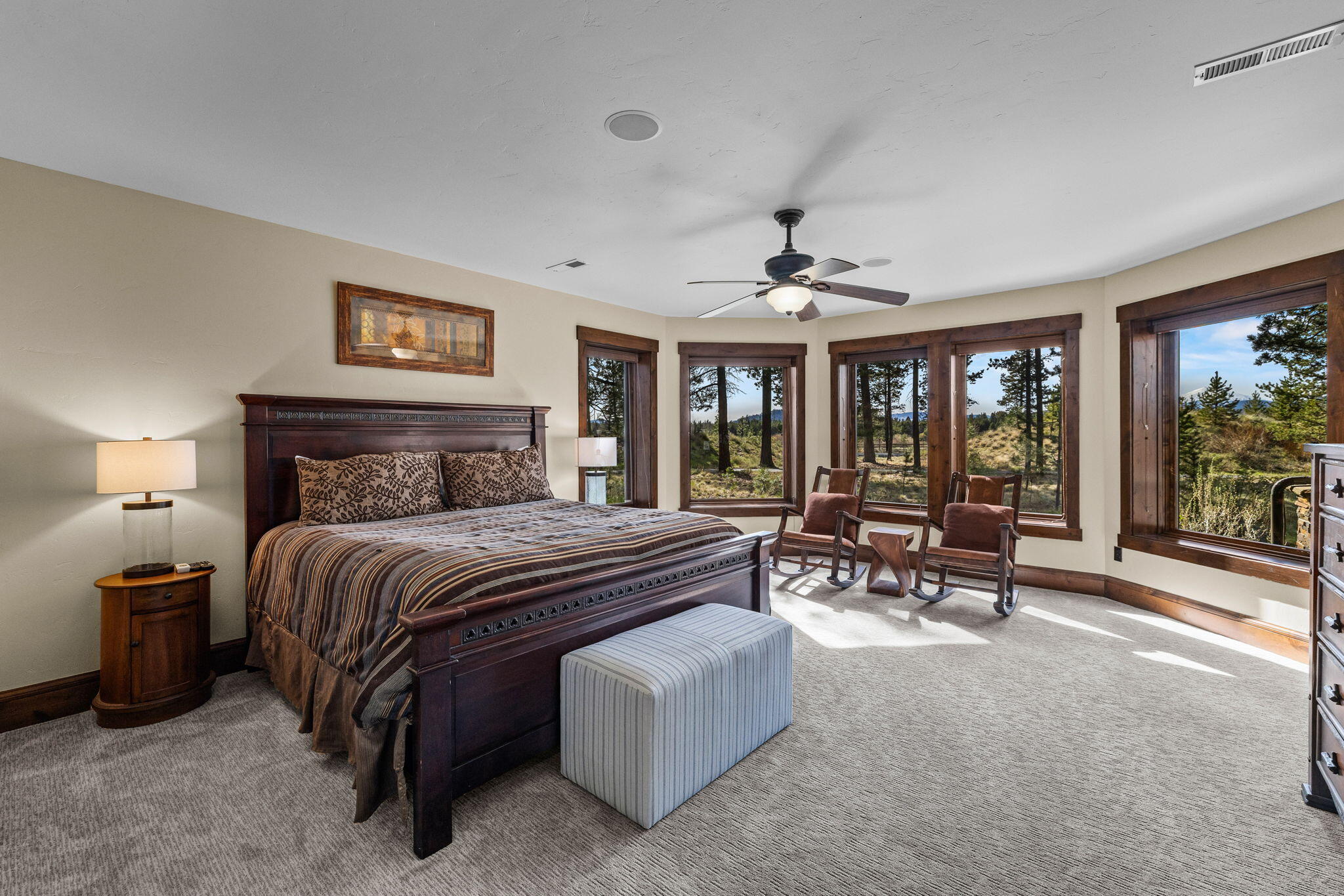 56373 Trailmere Circle Bend, OR 97707 - Photo 56 of 102 a spacious bedroom with a bed and a large window