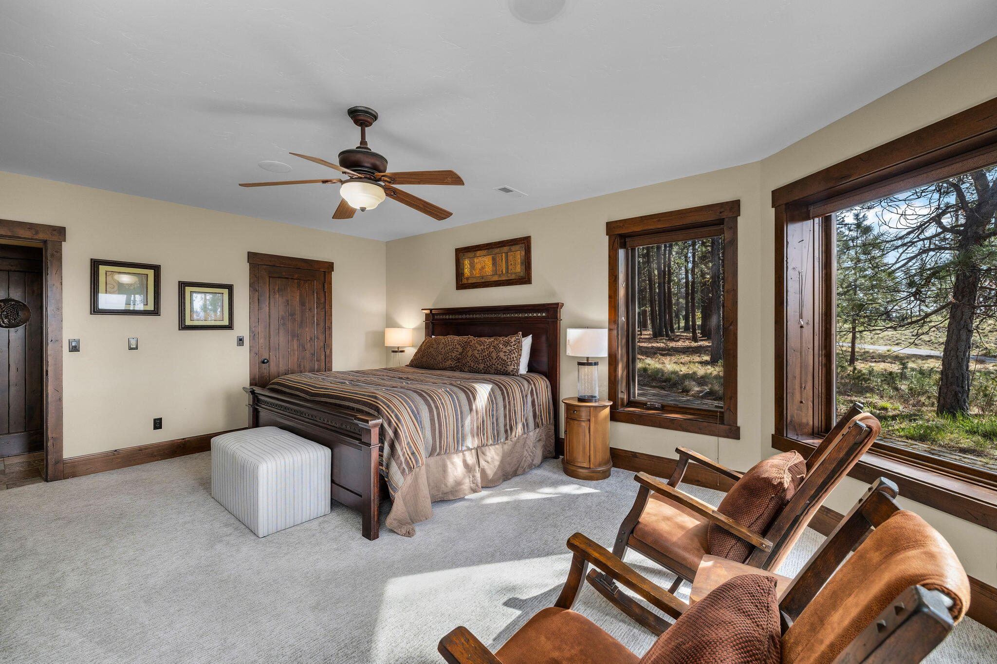56373 Trailmere Circle Bend, OR 97707 - Photo 57 of 102 a bedroom with a bed and glass walk in closet