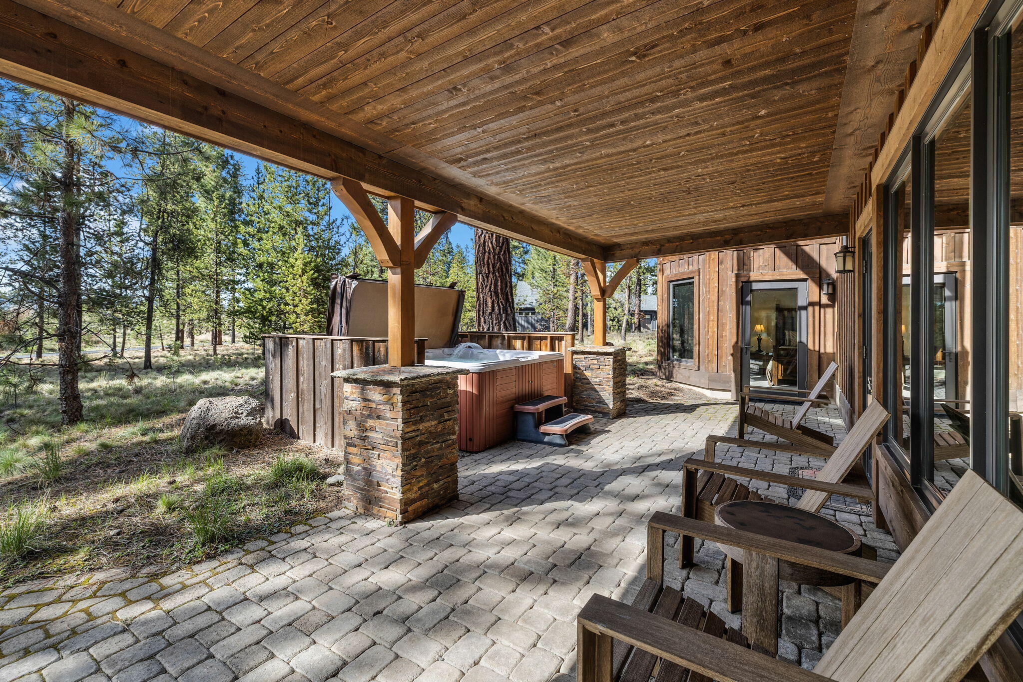 56373 Trailmere Circle Bend, OR 97707 - Photo 61 of 102 a view of a patio with chairs and a grill