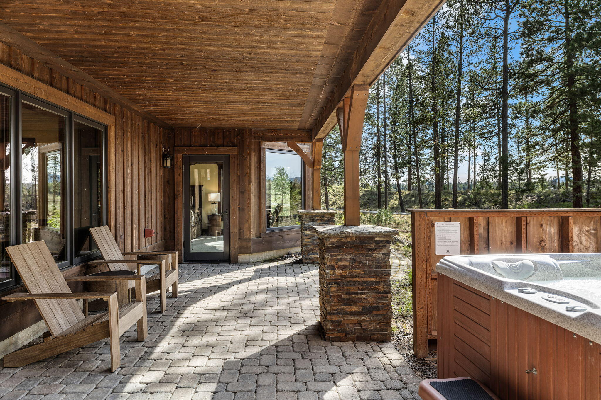 56373 Trailmere Circle Bend, OR 97707 - Photo 63 of 102 a view of a patio with table and chairs and wooden fence