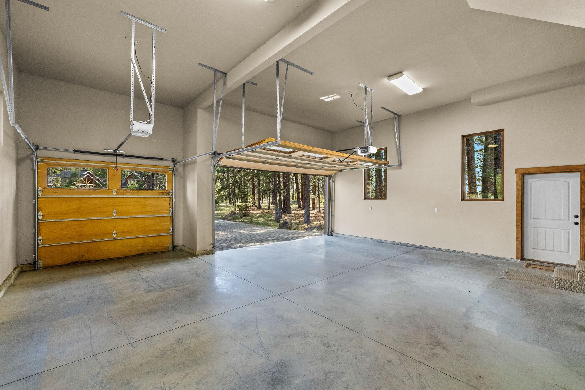56373 Trailmere Circle Bend, OR 97707 - Photo 68 of 102 a view of a room with furniture and a garage