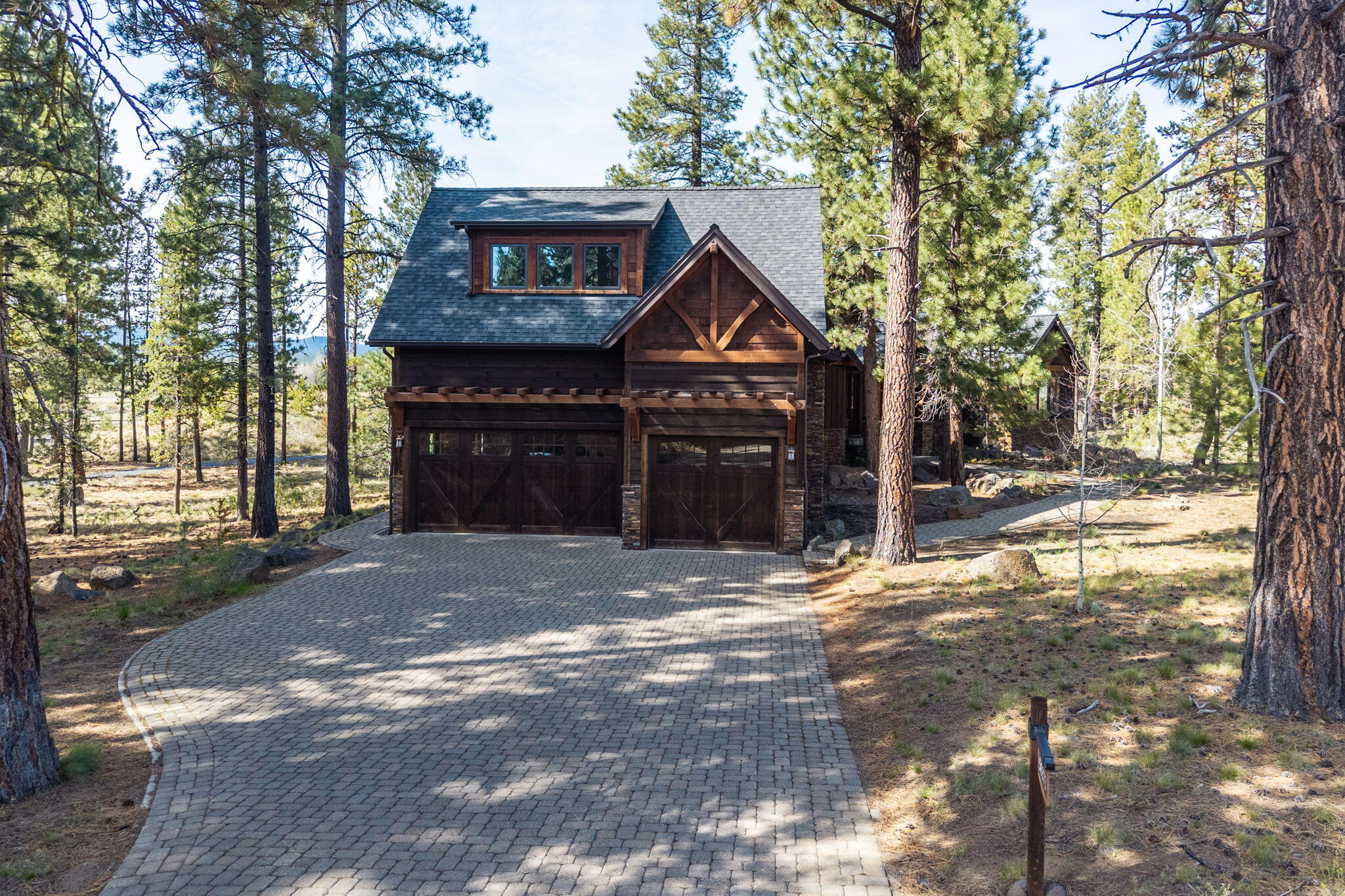 56373 Trailmere Circle Bend, OR 97707 - Photo 70 of 102 a front view of a house with a yard