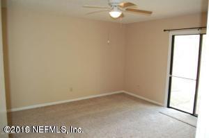 2939 Lakeside Villa Road, Unit G Orange Park, FL 32073 - Photo 5 of 9 an empty room with a window