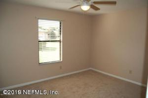 2939 Lakeside Villa Road, Unit G Orange Park, FL 32073 - Photo 7 of 9 an empty room with a window