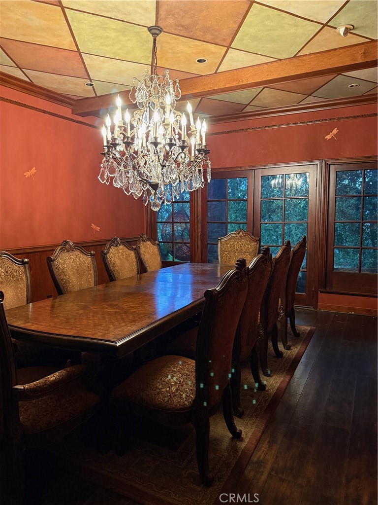 380 North Chandler Ranch Road Orange, CA 92869 - Photo 11 of 40 a view of a dining room with furniture a chandelier and wooden floor