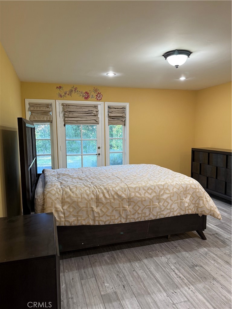 380 North Chandler Ranch Road Orange, CA 92869 - Photo 17 of 40 a bed sitting in a spacious bedroom next to a window