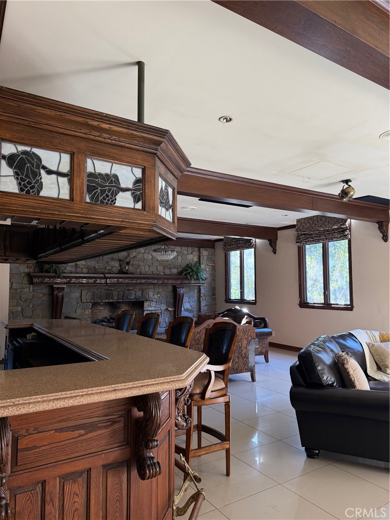 380 North Chandler Ranch Road Orange, CA 92869 - Photo 24 of 40 a living room with furniture a rug and a fireplace