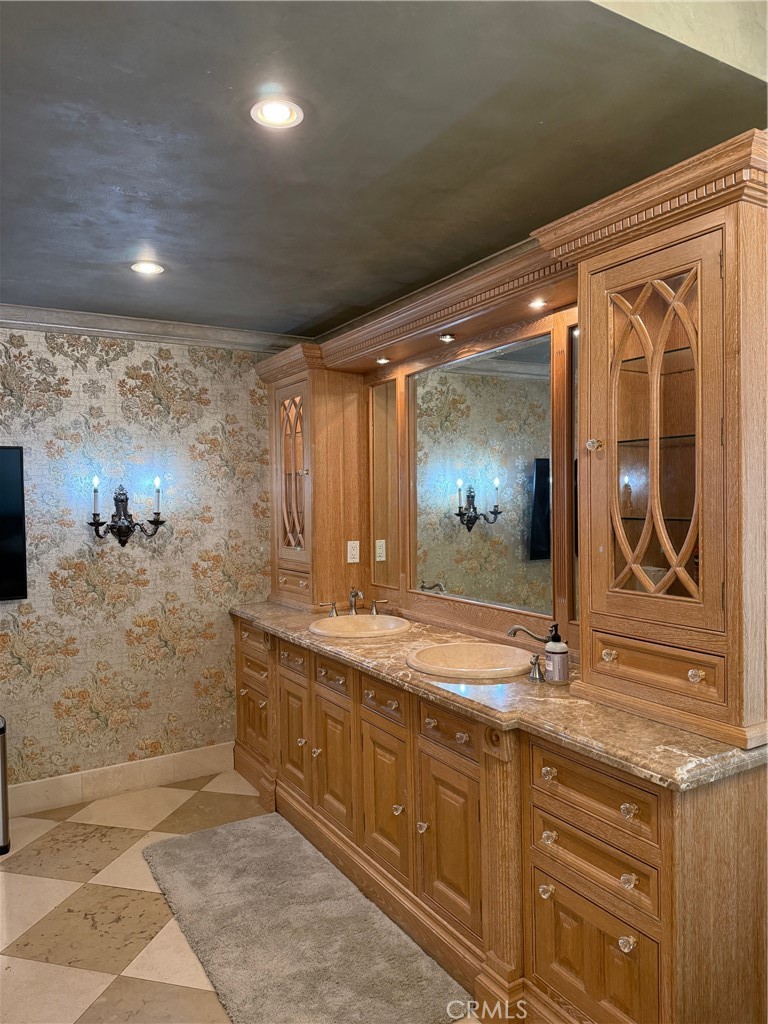 380 North Chandler Ranch Road Orange, CA 92869 - Photo 27 of 40 a bathroom with a granite countertop sink a mirror and a shower
