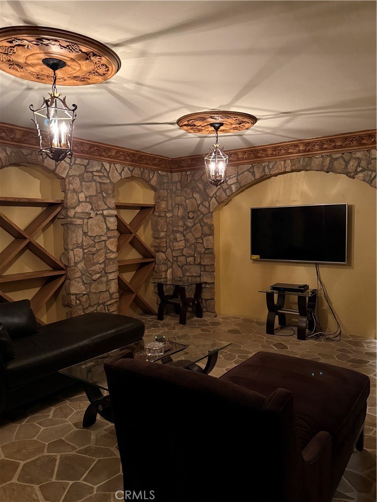 380 North Chandler Ranch Road Orange, CA 92869 - Photo 36 of 40 a bedroom with a bed and a flat tv screen on the dresser