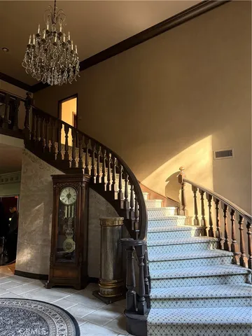 a living room with furniture a fireplace and a large window