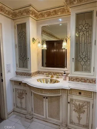 a bathroom with a sink vanity and mirror