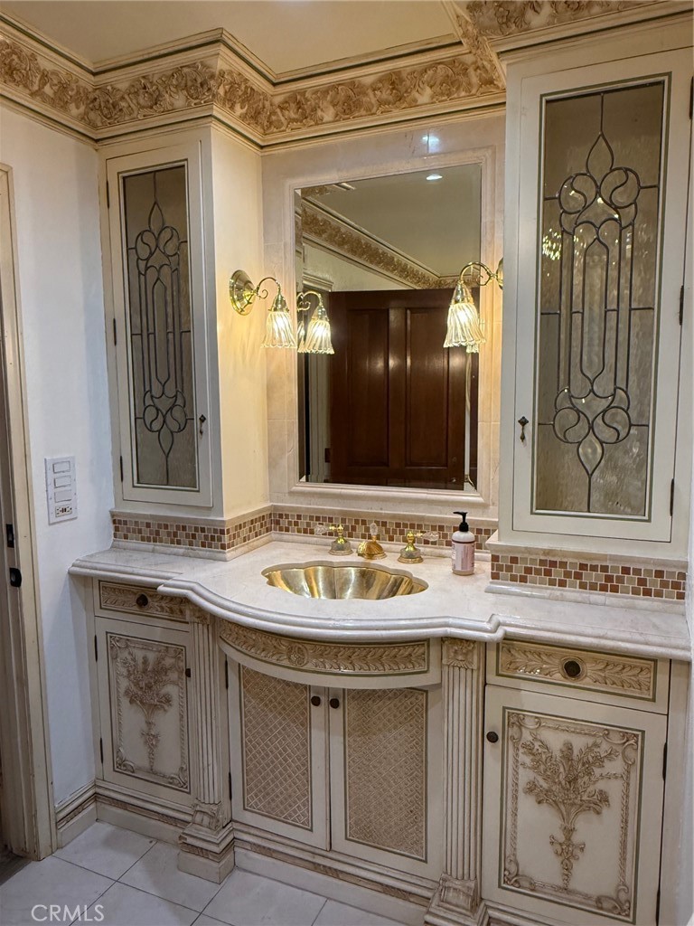 380 North Chandler Ranch Road Orange, CA 92869 - Photo 7 of 40 a bathroom with a sink vanity and mirror