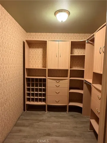 a living room with furniture and large windows