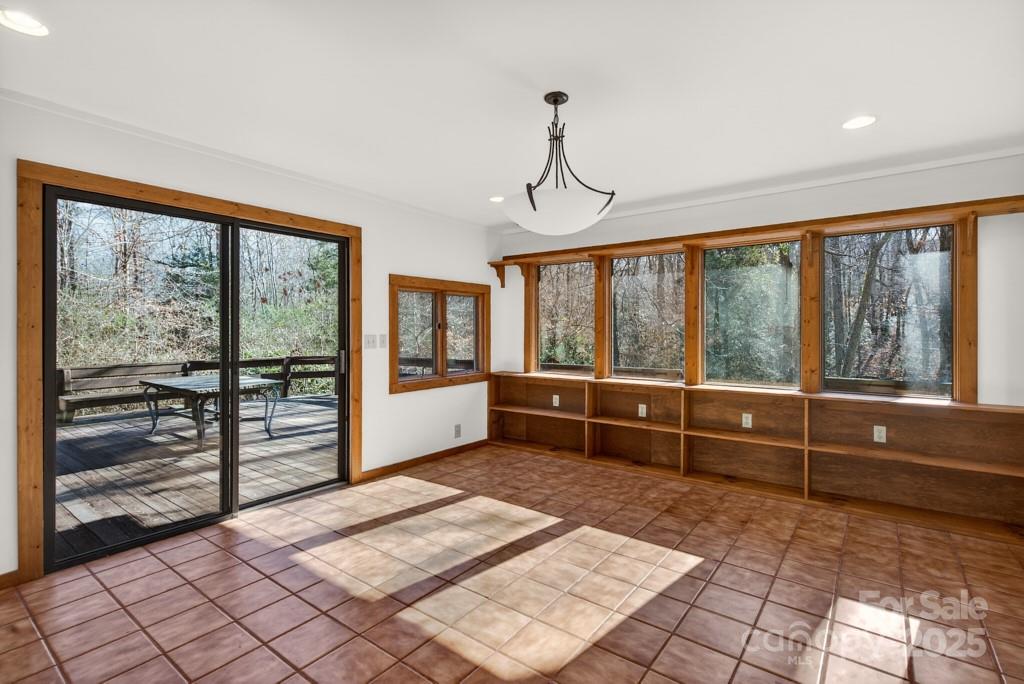 241 Pinefield Drive Tryon, NC 28782 - Photo 12 of 39 a large room with a large window and table