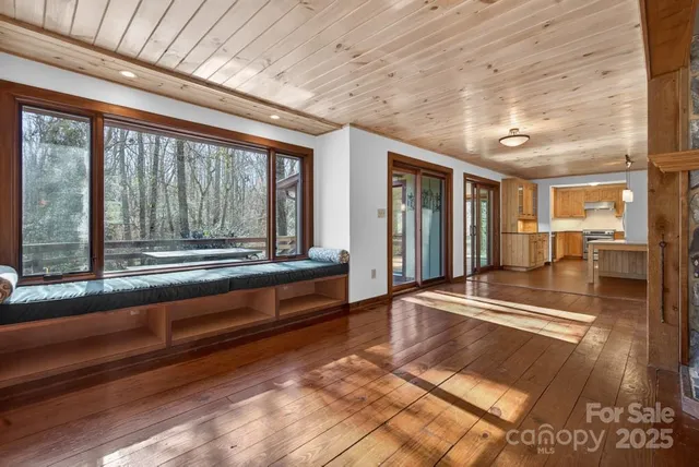 a lobby with furniture and floor to ceiling window