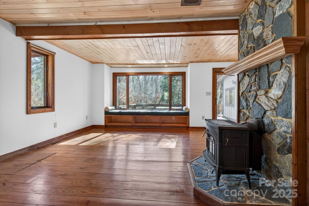 241 Pinefield Drive Tryon, NC 28782 - Photo 17 of 39 a view of an empty room with wooden floor and a window