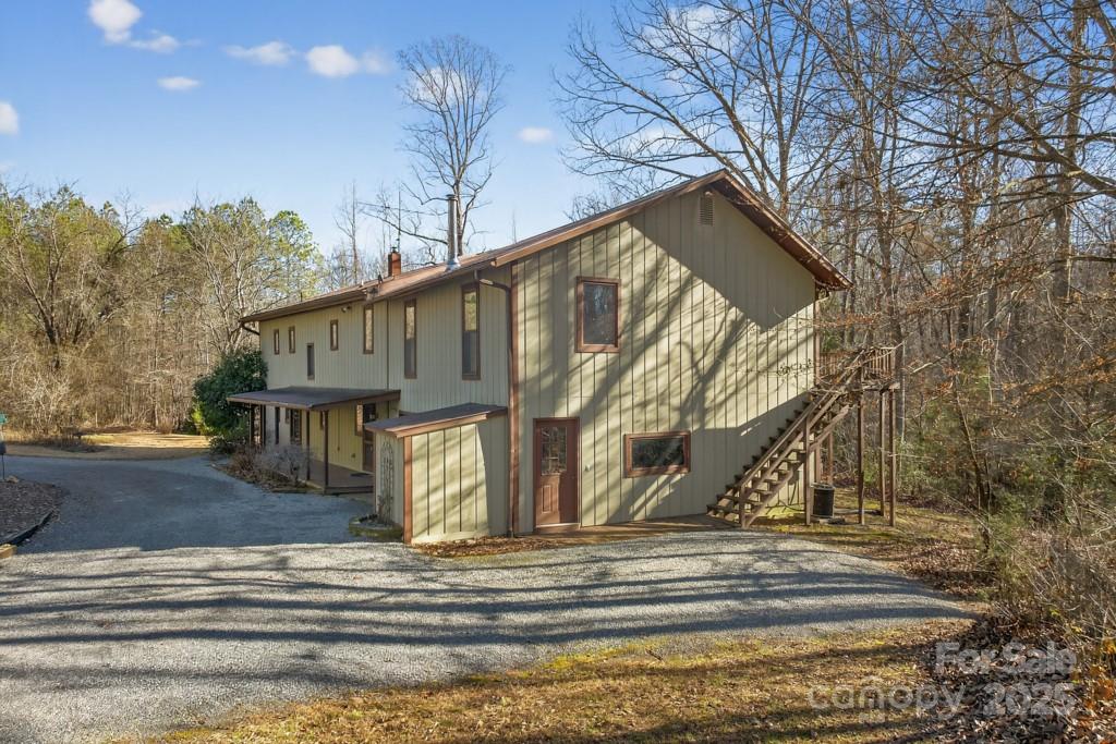241 Pinefield Drive Tryon, NC 28782 - Photo 2 of 39 a view of a house with snow on the road