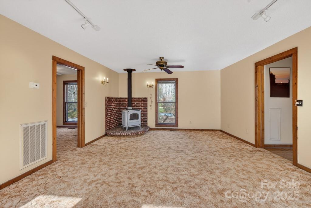 241 Pinefield Drive Tryon, NC 28782 - Photo 31 of 39 an empty room with kitchen view and a window