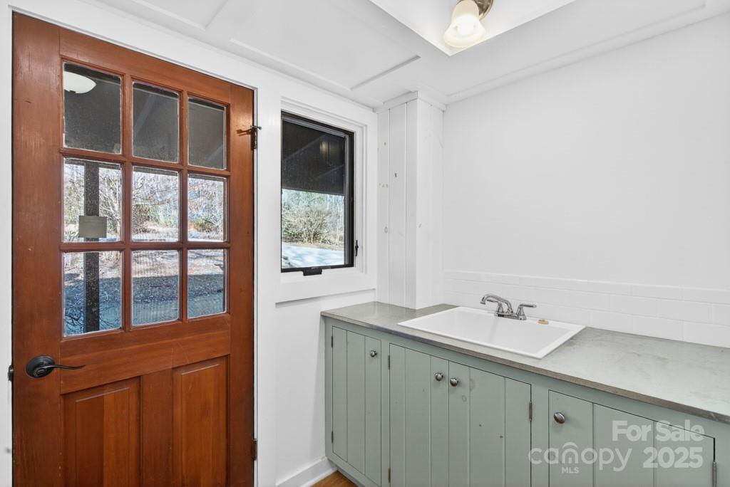 241 Pinefield Drive Tryon, NC 28782 - Photo 6 of 39 a bathroom with a sink and a window