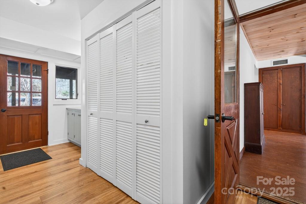 241 Pinefield Drive Tryon, NC 28782 - Photo 7 of 39 a view of a hallway with wooden floor and entryway