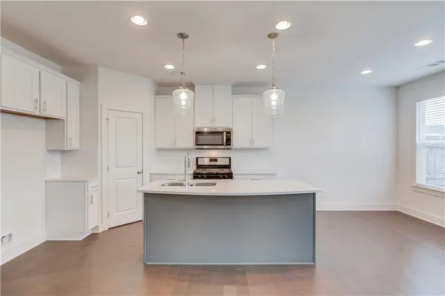 a kitchen with a stove and a fireplace