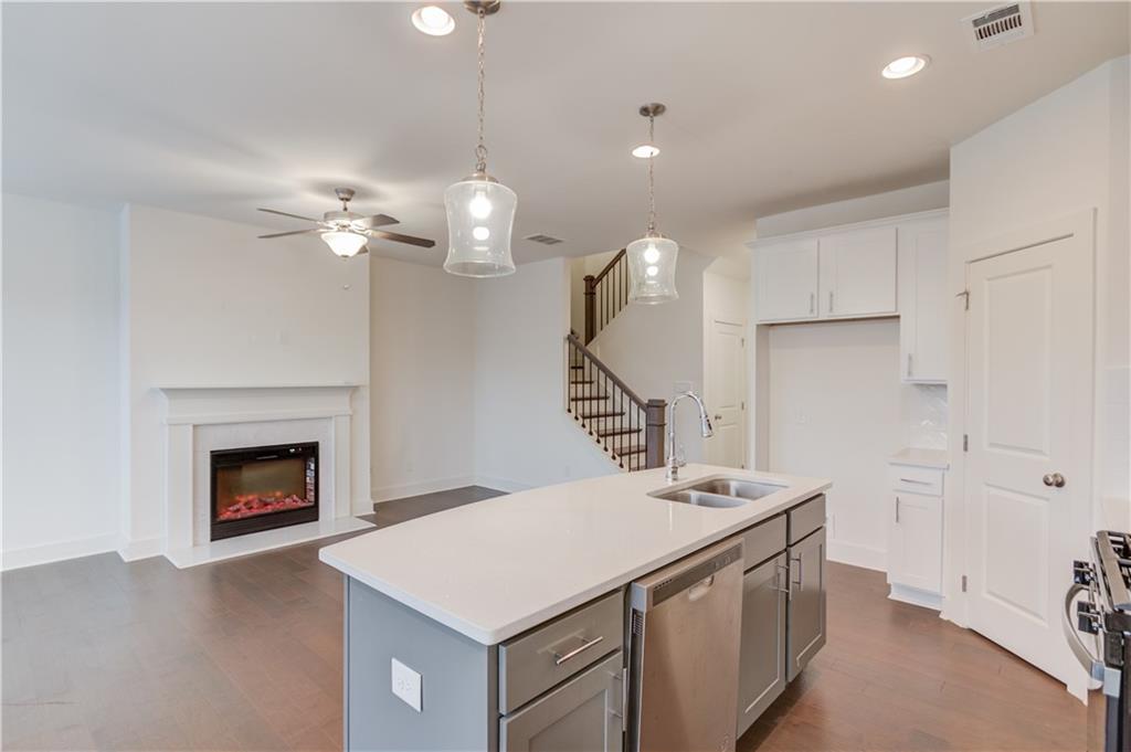 74 Cannon Trace Drive Winder, GA 30680 - Photo 12 of 42 a kitchen with a stove and a fireplace